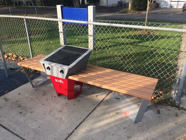 The Soofa solar-powered phone charging bench at the Melrose Common