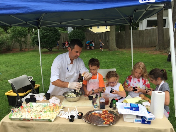 Photo of children having a cooking lesson at the Farmers Market
