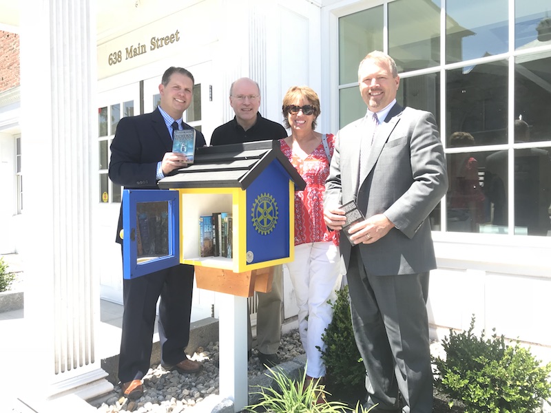 Photo of Rotary Club members with Little Free Library