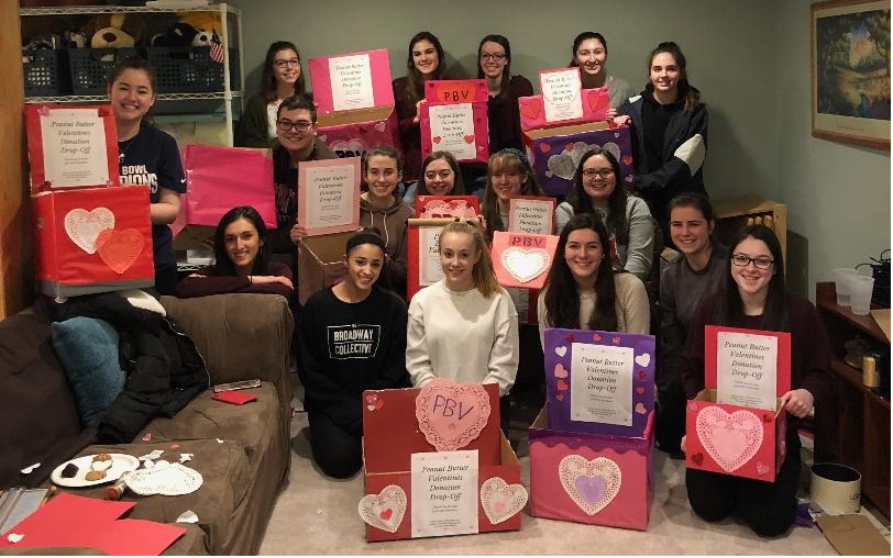 Photo of teenagers with Peanut Butter Valentine donation boxes