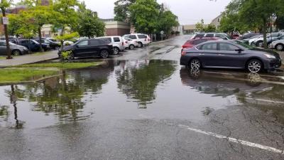 Puddle covering large area of City Hall parking lot