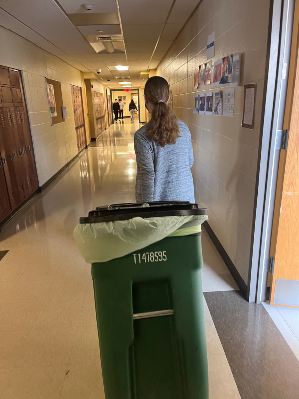 MHS Student Pulls a Compost Bin To the Cafeteria