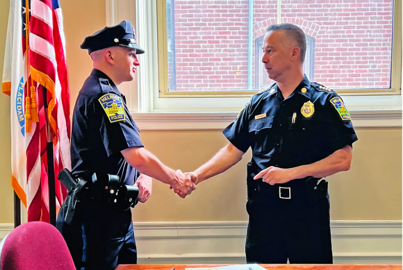 Melrose Police Chief and New Recruit Pinkethman Shake Hands