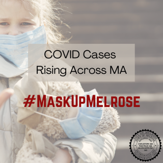 Little girl wearing a mask and holding a teddy bear also wearing a mask. Text reads: Covid Cases Rising Across MA #MaskUpMelrose