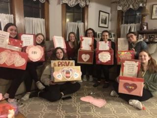 Photo of teenagers with boxes for Peanut Butter Valentines donations
