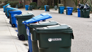 Photo of trash and recycling toters placed curbside for collection