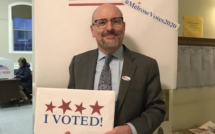 Photo of Mayor Holding "I Voted" sign