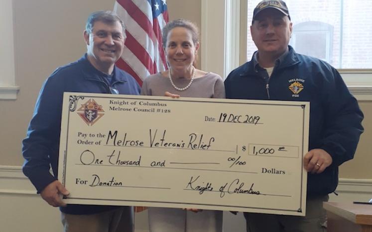 Photo of Veterans Services Officer Karen Burke with members of Knights of Columbus