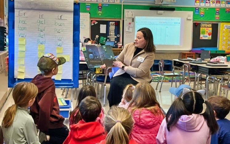 Mayor Jen reads to a classroom.